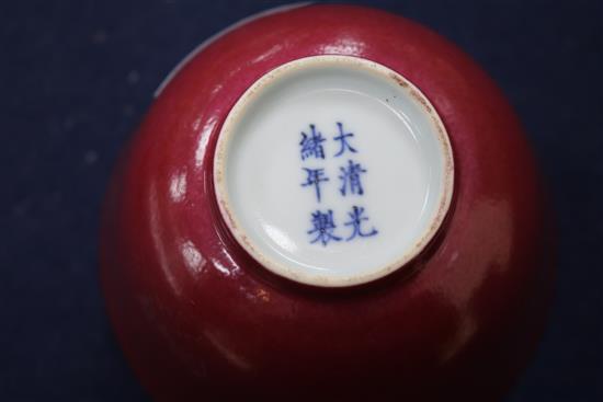 A Chinese red glazed tea bowl on stand 10.5cm
